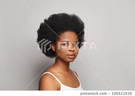 Young female face closeup studio portrait 100822838