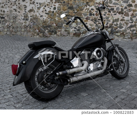 Black classic chopper motorcycle with chrome details 100822883