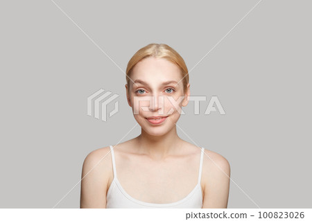 Portrait of glamorous woman with blonde hair smiling Portrait of glamorous woman with blonde hair smiling 100823026