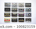 Collection of old audio cassette tapes isolated on white background, vintage music 100823159