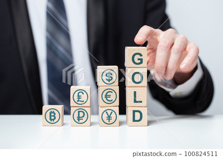 Word gold and green currency icons on wooden blocks 100824511
