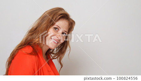 Attractive lady with red hair on white background 100824556
