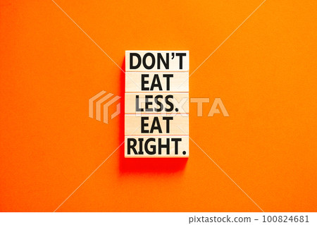 Eat less or right symbol. Concept words Do not eat less, eat right on wooden blocks. Beautiful orange table orange background. Healthy lifestyle and eat less or right concept. Copy space. 100824681