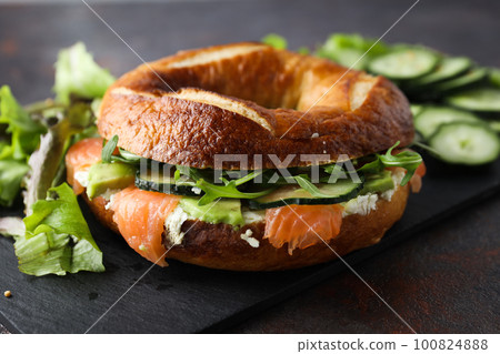 Concept of delicious food - tasty bagel sandwich Concept of delicious food - tasty bagel sandwich 100824888