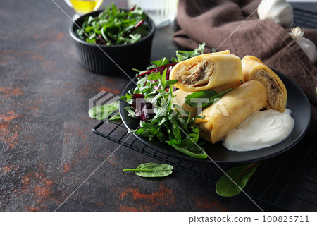 Concept of tasty food, thin pancakes with filling, space for text Concept of tasty food, thin pancakes with filling, space for text 100825711