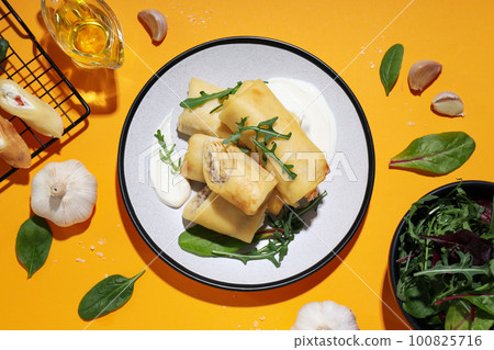 Concept of tasty food, thin pancakes with filling, top view 100825716