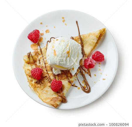 plate of crepe with ice cream and raspberries plate of crepe with ice cream and raspberries 100826094