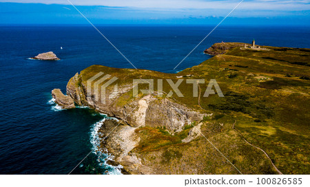 Cliffs At Atlantic Coast With Ancient Lighthouse At Cap Frehel In Brittany, France; Phare du Cap Frehel 100826585