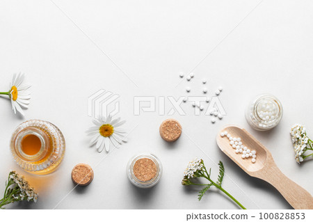 Homeopathic medicines and medicinal plants on a light background, copy space Homeopathic medicines and medicinal plants on a light background, copy space 100828853