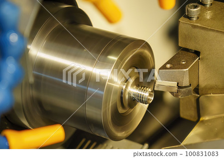 The CNC lathe machine thread cutting at the end of metal stud parts. The CNC lathe machine thread cutting at the end of metal stud parts. 100831083