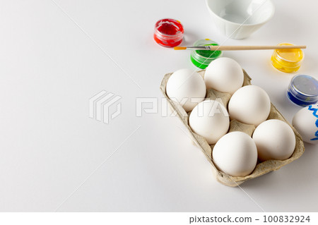 Image of easter eggs, paintbrush and paints with copy space on white background Image of easter eggs, paintbrush and paints with copy space on white background 100832924