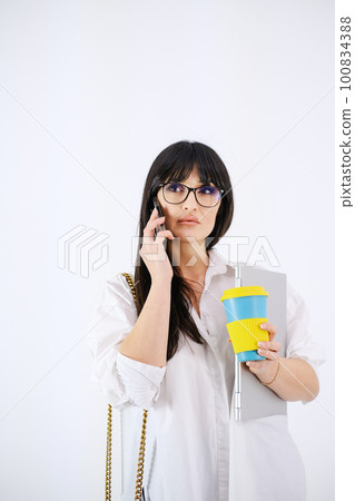 Selective focus woman with cell phone white background Selective focus woman with cell phone white background 100834388