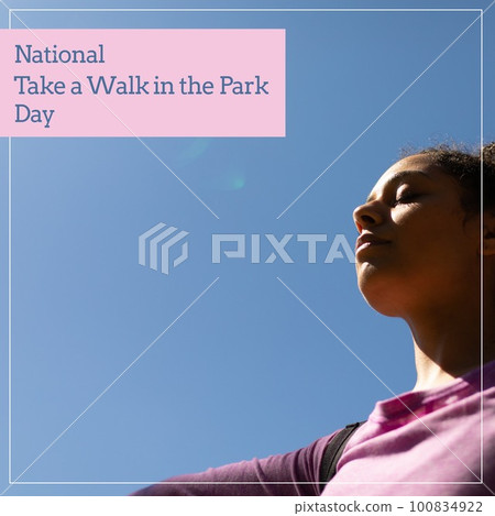 National take a walk in the park day text over biracial woman practicing yoga in park 100834922
