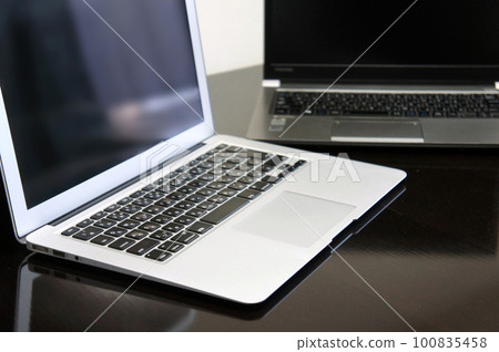 two laptops on the table 100835458
