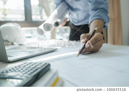 Engineer, architects working alone. 100835516