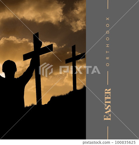 Orthodox easter text and silhouette man with arms outstretched praying to cross under cloudy sky 100835625