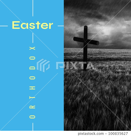 Composite of orthodox easter text on blue background and cross on grassy land against storm clouds Composite of orthodox easter text on blue background and cross on grassy land against storm clouds 100835627