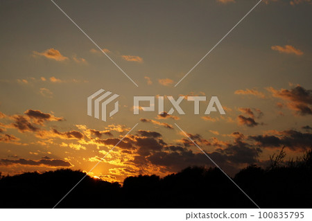 Sunset silhouette of church cross at sunset. Sunset silhouette of church cross at sunset. 100835795
