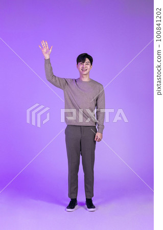 handsome Korean young man saying hello, greeting handsome Korean young man saying hello, greeting 100841202