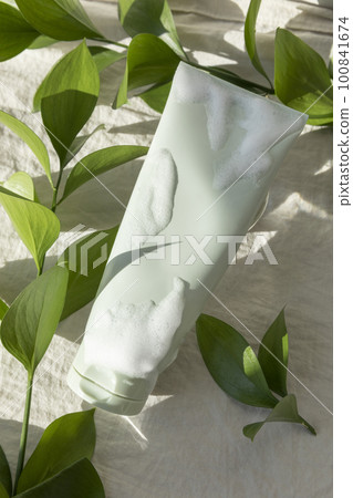 creative photo of nature and beauty products, foam cleansing and leaves creative photo of nature and beauty products, foam cleansing and leaves 100841674