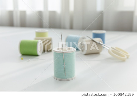 aesthetic photo of handmade, crafting hobbies, thread and a needle 100842199