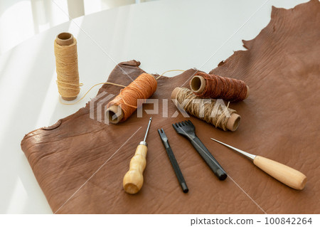aesthetic photo of handmade, crafting hobbies, leather and wax thread tools 100842264