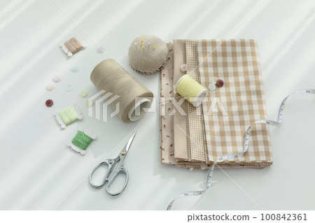 aesthetic photo of handmade, crafting hobbies, tape measure of fabric and measure of thread scissors 100842361