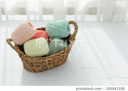 aesthetic photo of handmade, crafting hobbies, knitting thread in a basket 100842386