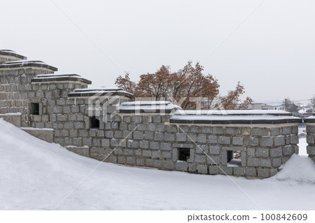 beautiful snowing winter scenery in Suwon Hwaseong Fortress trail in Korea beautiful snowing winter scenery in Suwon Hwaseong Fortress trail in Korea 100842609