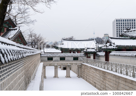 snowing winter scenery of Changdeokgung palace, Korea snowing winter scenery of Changdeokgung palace, Korea 100842667