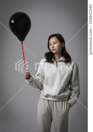 stressed, depressed Korean business woman in pink suit, worrying stressed, depressed Korean business woman in pink suit, worrying 100842840