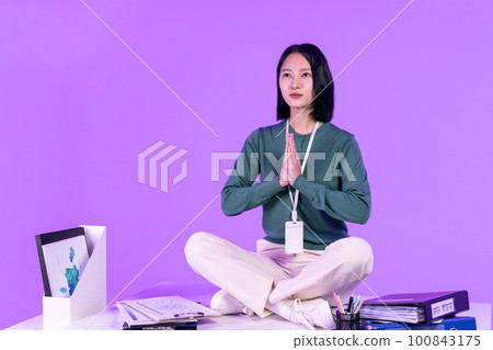 business working concept, young Korean Asian woman_young people sitting on the table with serious expressions face business working concept, young Korean Asian woman_young people sitting on the table with serious expressions face 100843175
