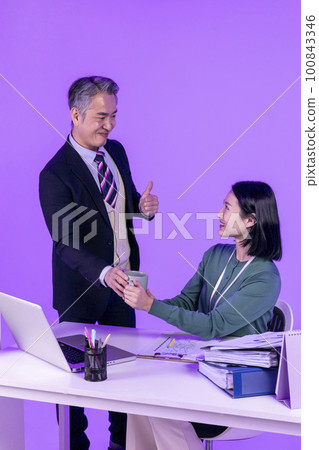 relationship and conflict between younger and older workers concept, Korean Asian young woman and manager level older man 100843346