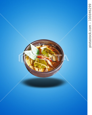 Floating Brown bowl with a red curry on blue gradient Floating Brown bowl with a red curry on blue gradient 100846299