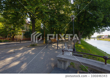 river in the town in morning light. warm sunny weather in uzhhorod 100846343