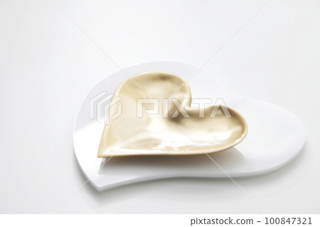 Gold heart plate on a heart tray Heart image of love 100847321