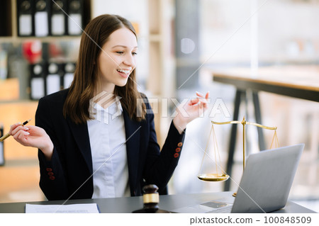 justice and law concept .Female judge in a courtroom on table and Counselor working in office. justice and law concept .Female judge in a courtroom on table and Counselor working in office. 100848509