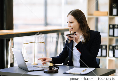 justice and law concept .Female judge in a courtroom on table and Counselor working in office. justice and law concept .Female judge in a courtroom on table and Counselor working in office. 100848510