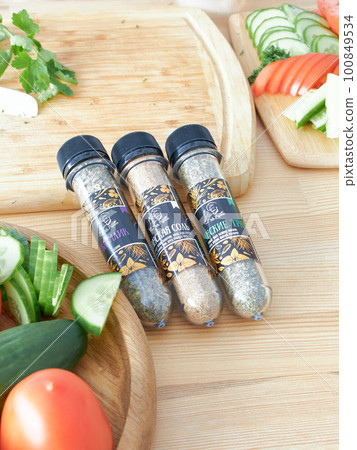A set of glass jars with different spices in a wooden box in the kitchen. Kazan, 17 March 2023 A set of glass jars with different spices in a wooden box in the kitchen. Kazan, 17 March 2023 100849534