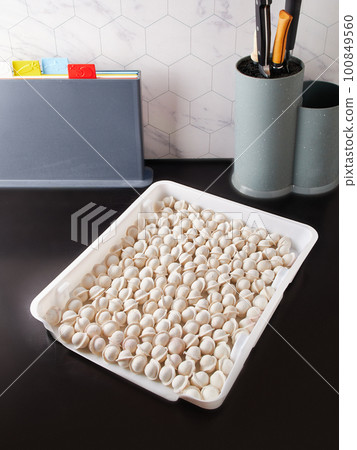Smart storage of frozen food in trays. Dumplings, berries, peppers are convenient to prepare for the winter 100849560