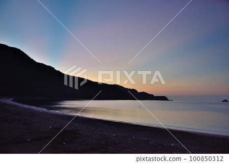 Amami Oshima, Katsuura's quiet sea illuminated by twilight Amami Oshima, Katsuura's quiet sea illuminated by twilight 100850312