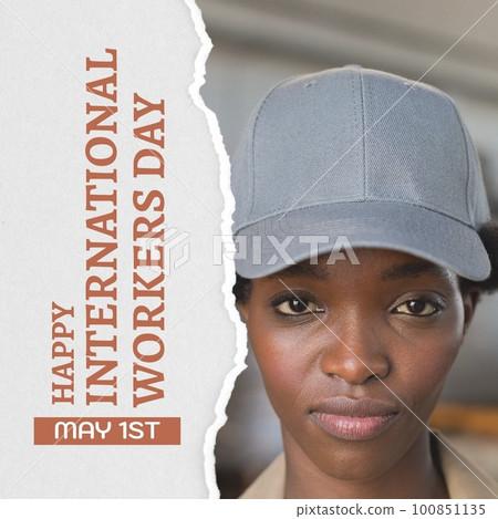 Composition of international workers day text and afrcian american woman working in warehouse 100851135
