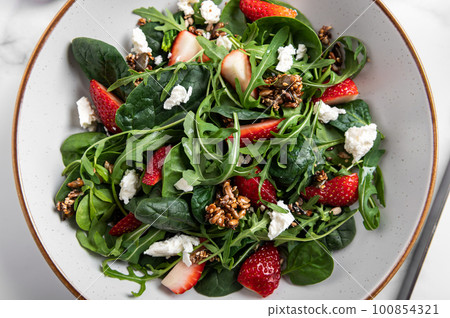Green Salad with Strawberries, Feta Cheese, Seeds Green Salad with Strawberries, Feta Cheese, Seeds 100854321