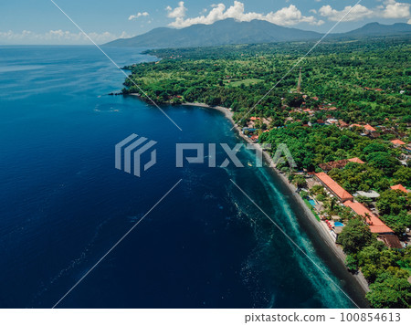 Aerial view of coastline with transparent ocean on Northern Bali. 100854613