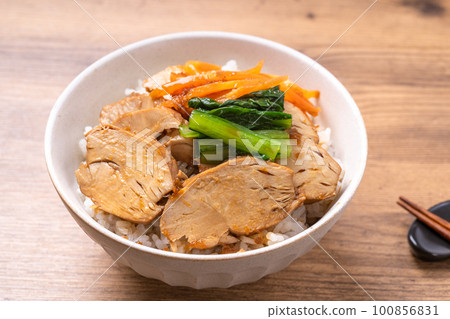 Chicken barbecued pork on rice 100856831