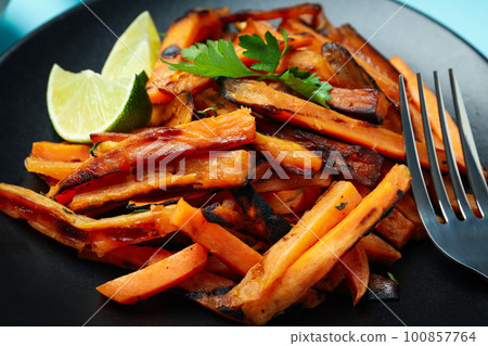 Concept of tasty food, fried sweet potato, close up Concept of tasty food, fried sweet potato, close up 100857764