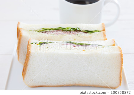 Delicious ham sandwich and hot coffee 100858872