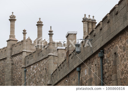 Vorontsov Palace exterior details under bright cloudy sky, Alupka Vorontsov Palace exterior details under bright cloudy sky, Alupka 100860816