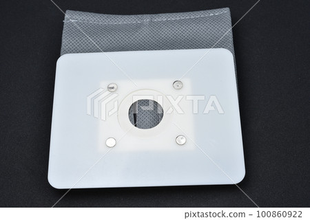 A vacuum cleaner bag. Grey bag for collecting dust in a vacuum cleaner. 100860922