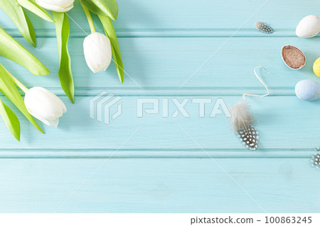Easter background with blue and white eggs Easter background with blue and white eggs 100863245